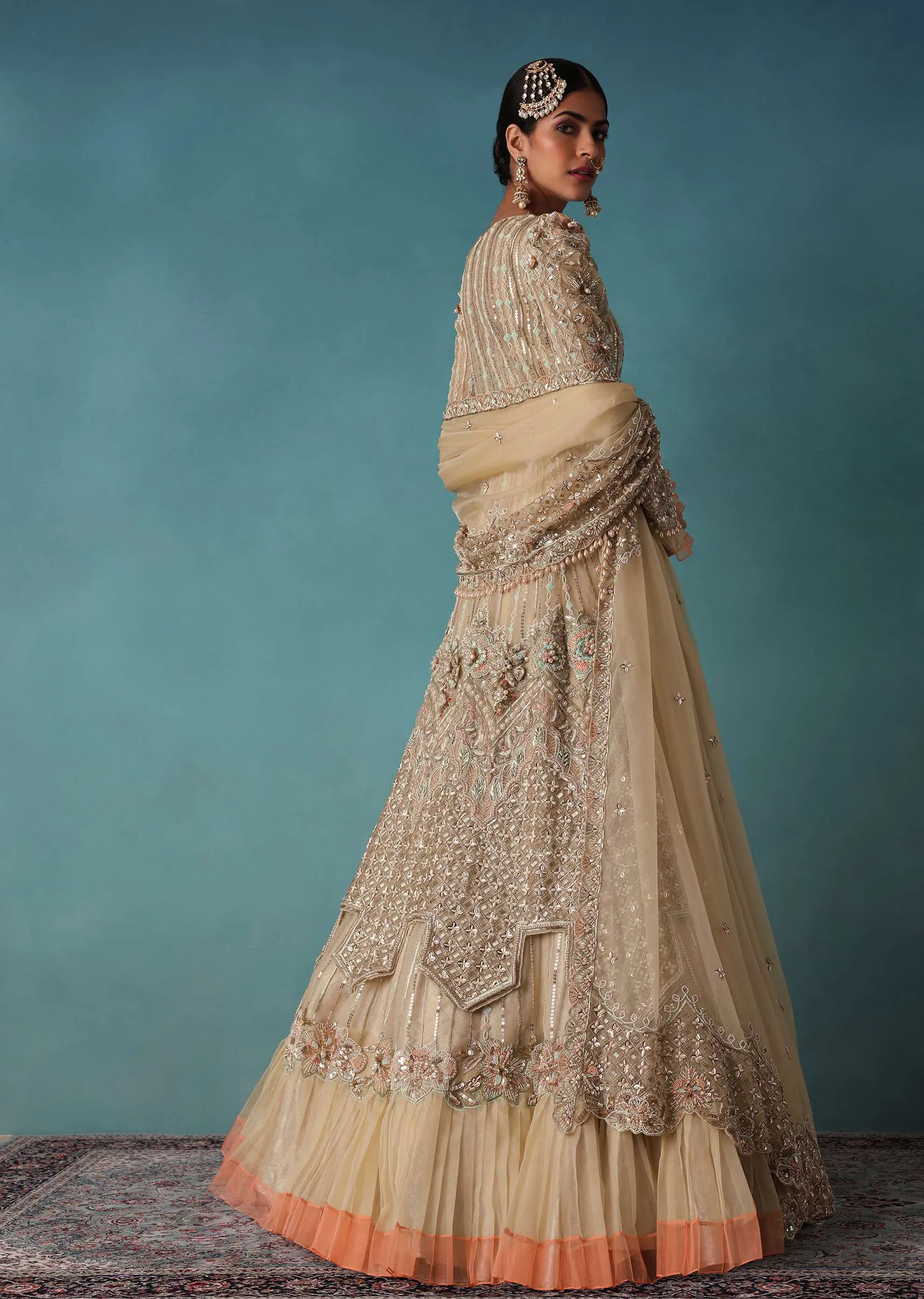 Gold Toned Embroidered Bridal Lehenga And Heavy Tube Top With Jacket