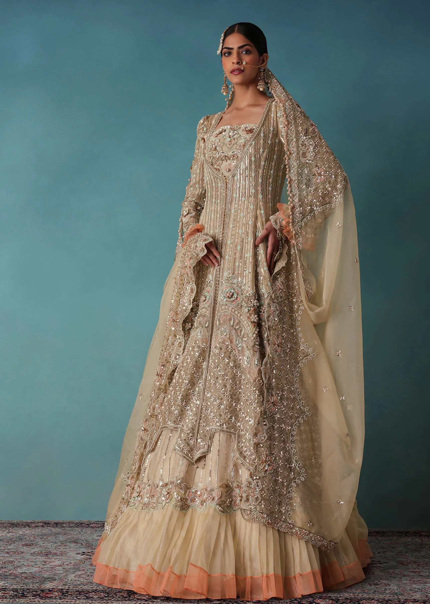 Gold Toned Embroidered Bridal Lehenga And Heavy Tube Top With Jacket